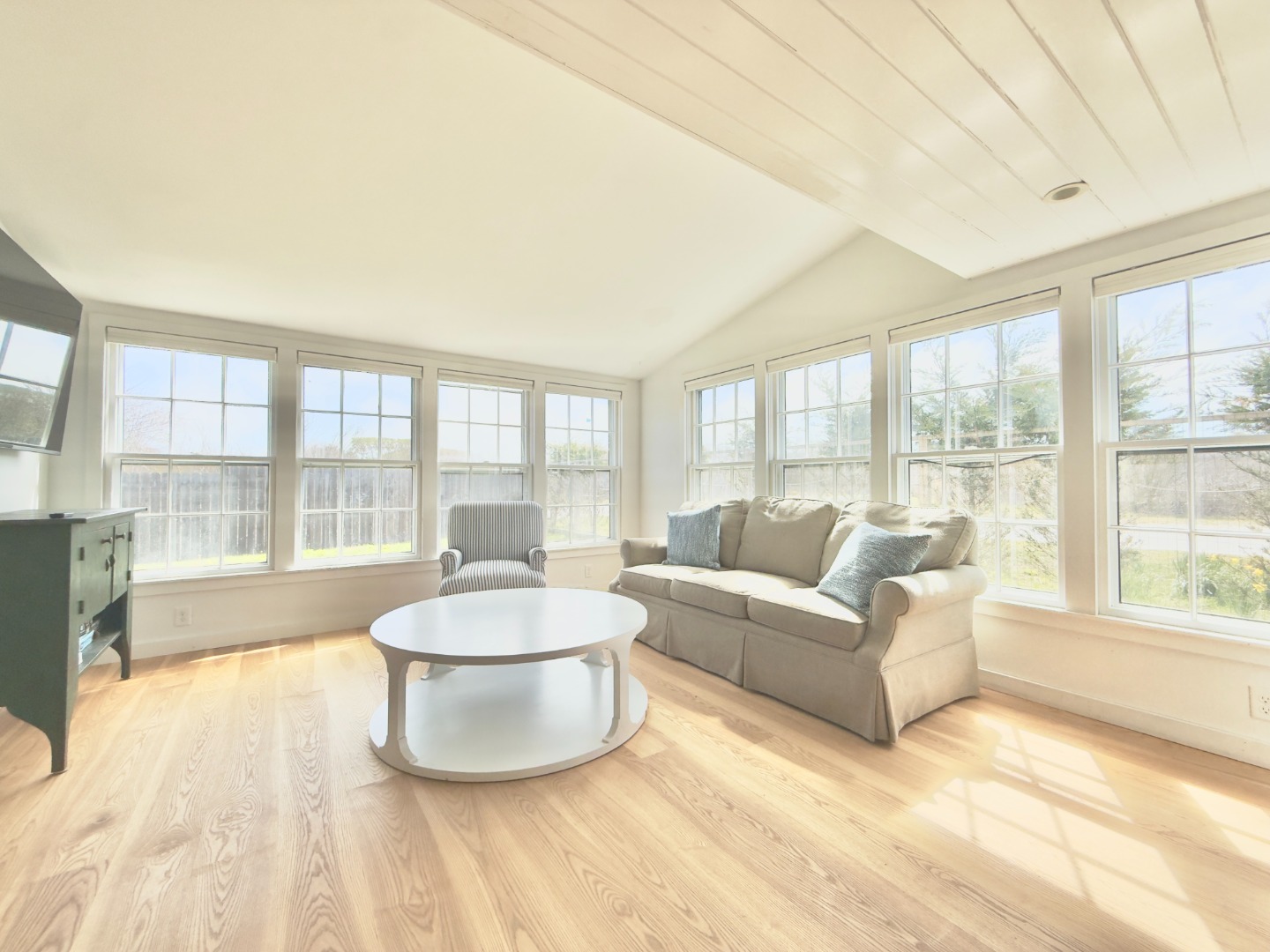 1 H Street Nantucket, MA 02554 - Photo 7 of 18 a living room with furniture and a large window