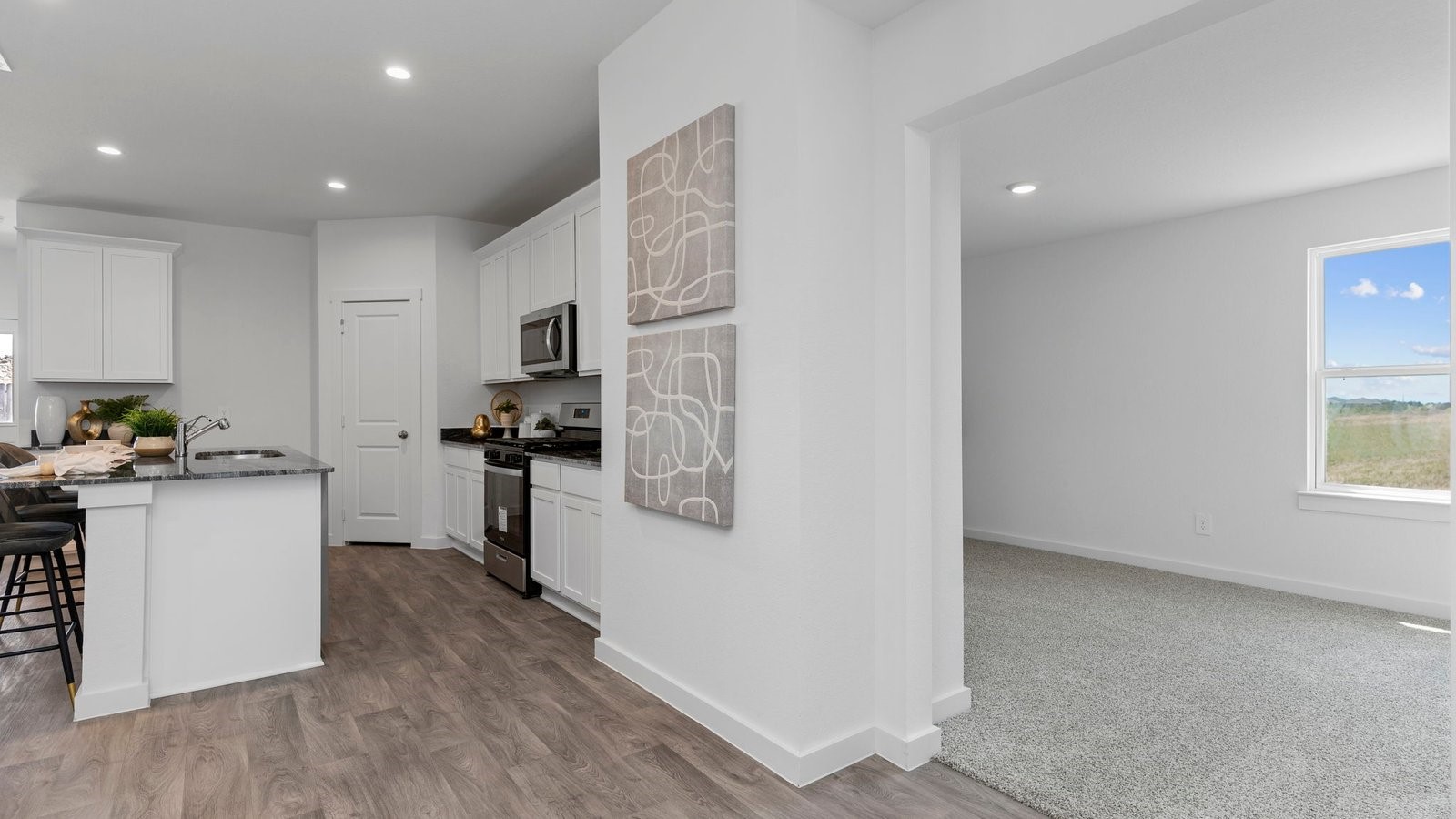 6107 Brookhaven Street Rosenberg, TX 77469 - Photo 11 of 40 a kitchen with a refrigerator and a stove top oven