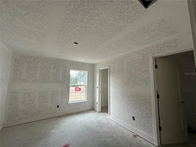 a view of an empty room and window