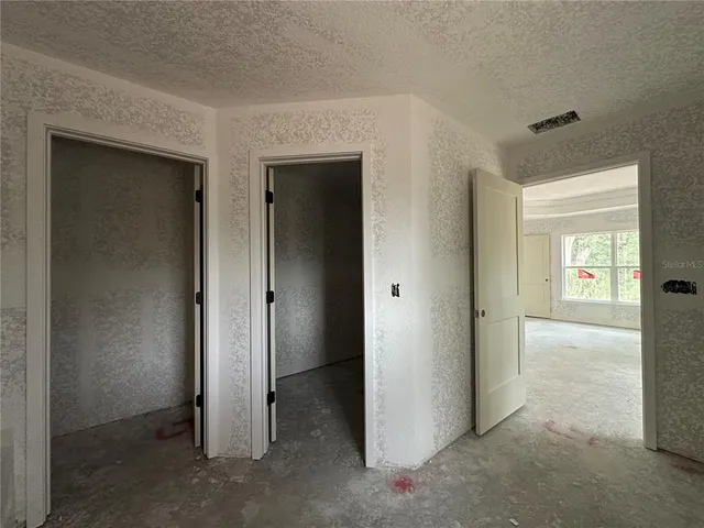 an empty room and windows