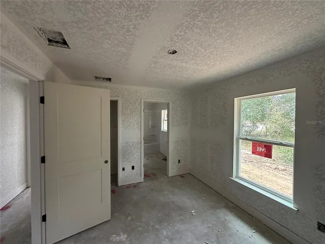 a view of an empty room and window