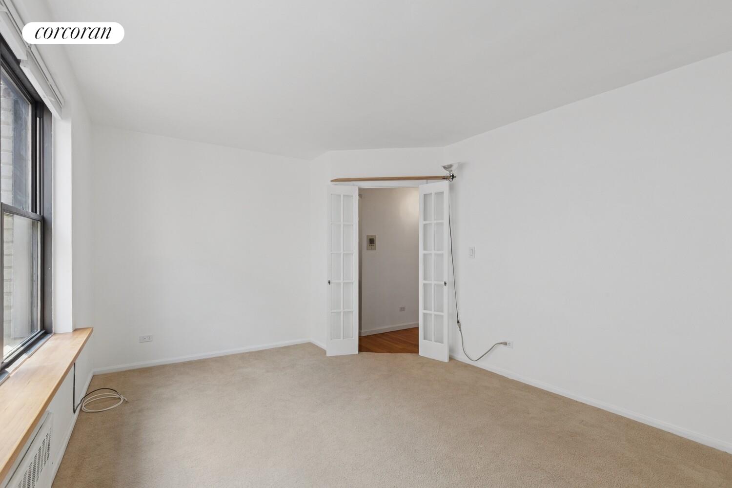 208 East 70th Street, Unit 6F Manhattan, NY 10021 - Photo 4 of 13 a view of an empty room