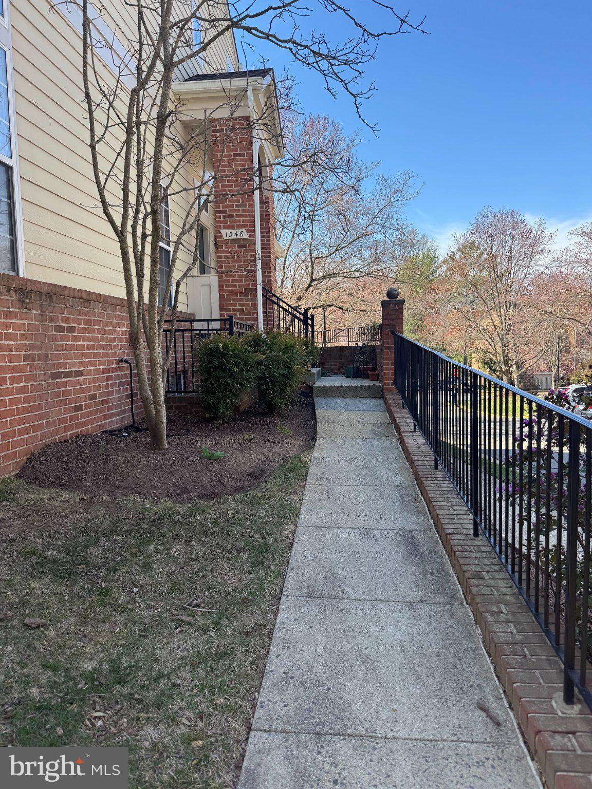 1348 Garden Wall Circle, Unit 513 Reston, VA 20194 - Photo 2 of 21 Charming walkway to a welcoming home.