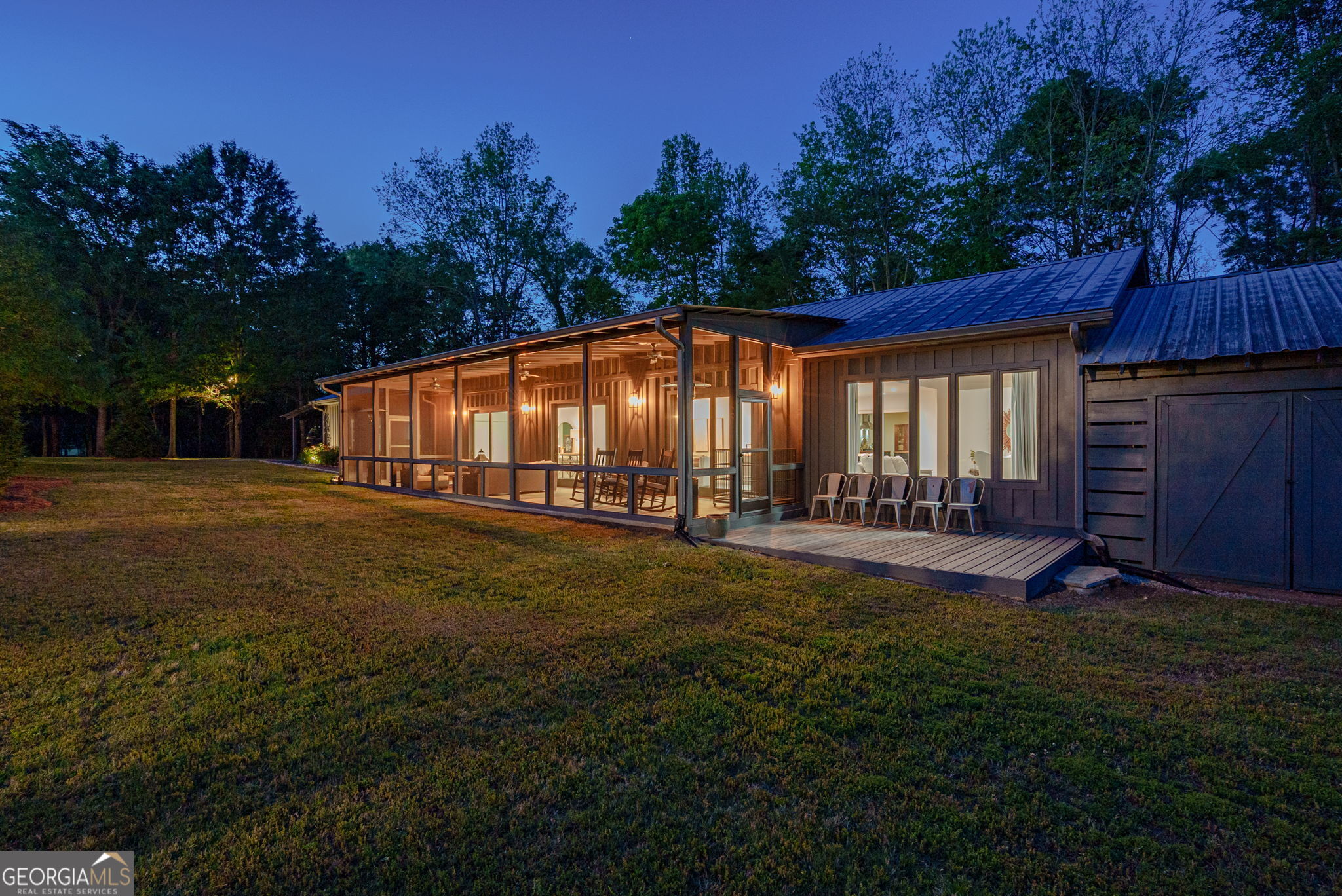 235 Glades Road Eatonton, GA 31024 - Photo 2 of 79 a view of back yard of the house with green space and porch