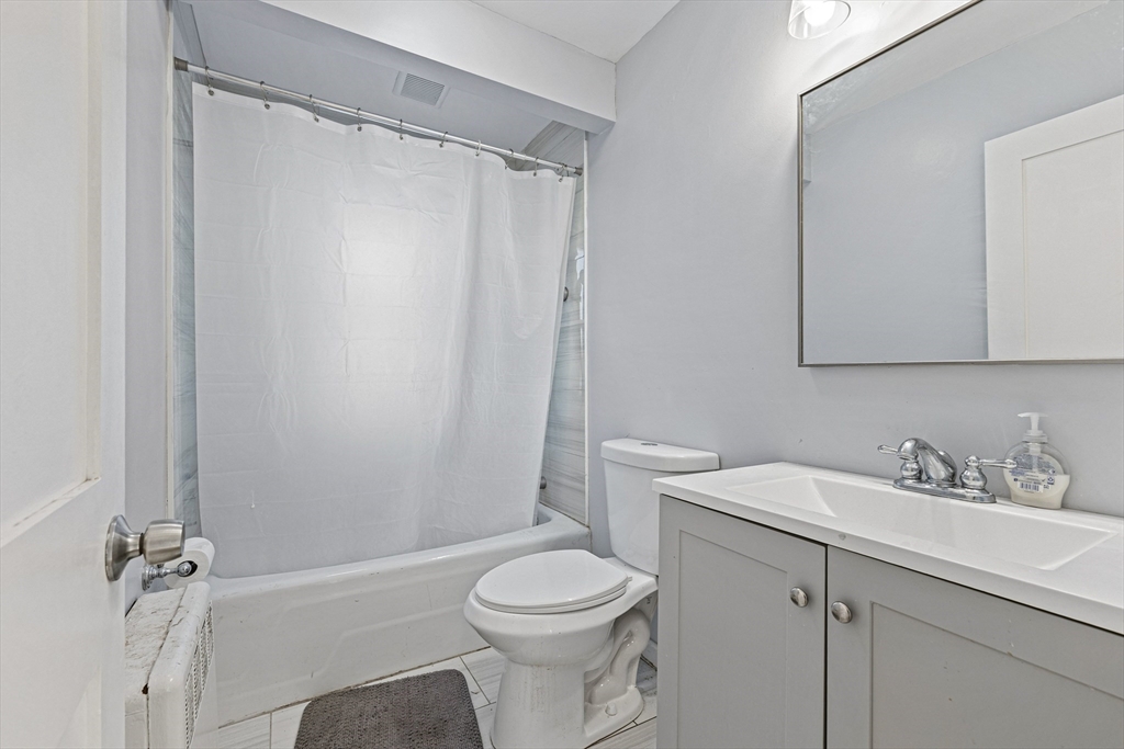 57-59 Larchwood Road, Unit 1 Methuen, MA 01844 - Photo 11 of 16 a bathroom with a sink toilet and shower
