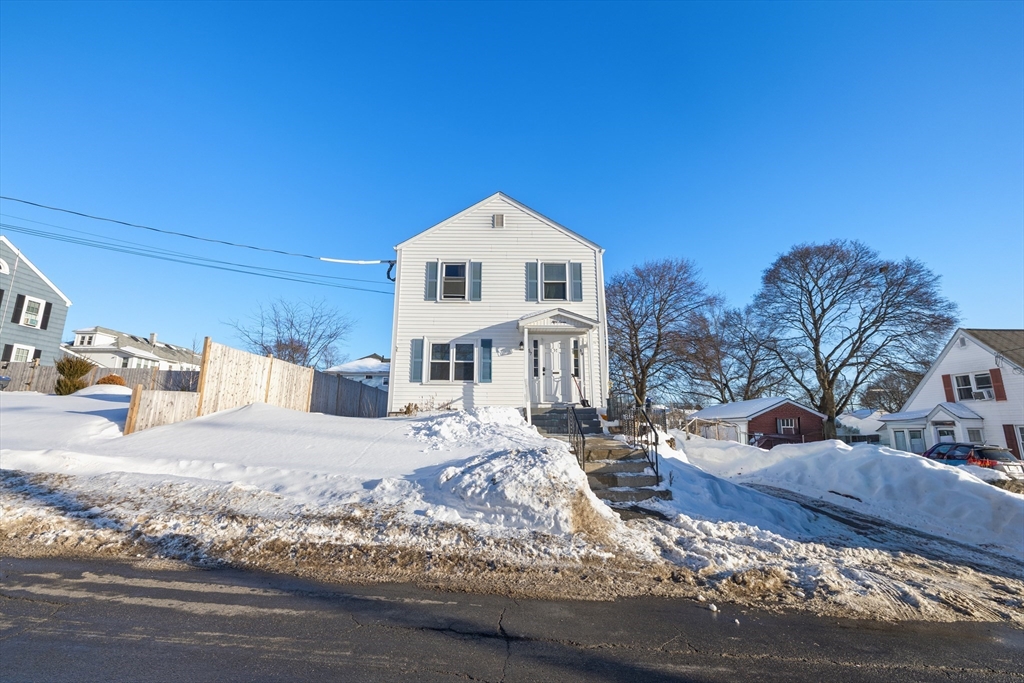 57-59 Larchwood Road, Unit 1 Methuen, MA 01844 - Photo 14 of 16 a large house with a large tree in front of it
