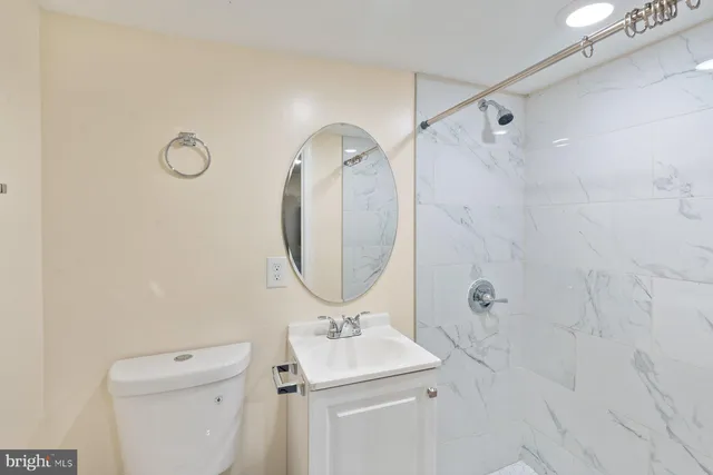 a room with a sink and a mirror