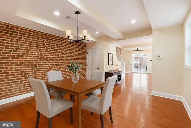 a kitchen with stainless steel appliances granite countertop wooden cabinets a stove a sink and a refrigerator