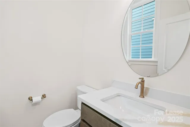 a large kitchen with a wooden floor and a large window