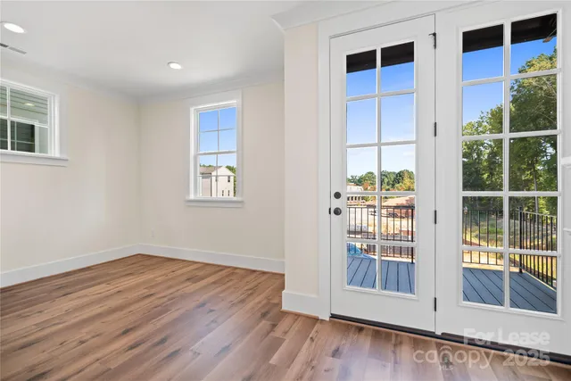 a view of entryway with wooden floor and stairs