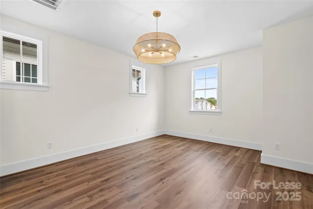 a bathroom with a sink a toilet a shower and a mirror