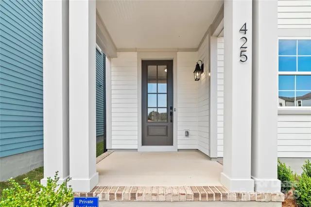 a view of entryway with wooden floor and stairs