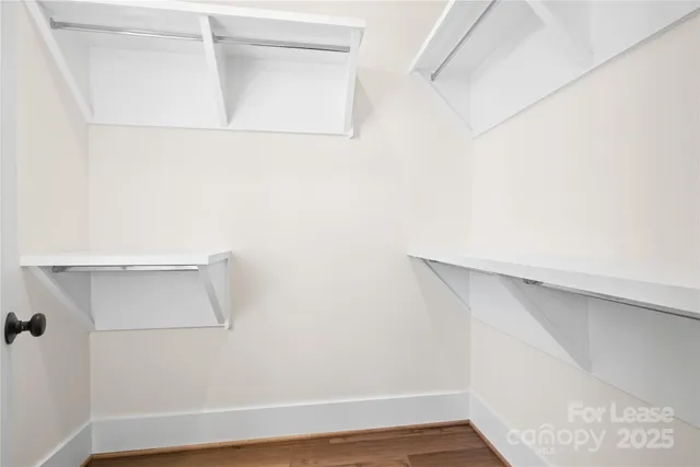 a bathroom with a sink a toilet a mirror a bathtub and shower