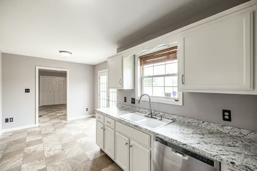 2029 Copper Kettle Circle Pleasant View, TN 37146 - Photo 20 of 58 a kitchen with granite countertop a sink and a window