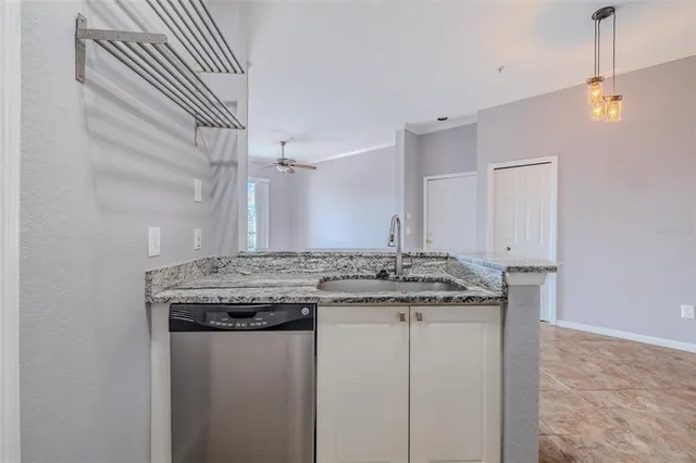 a view of a kitchen counter space and wooden floor