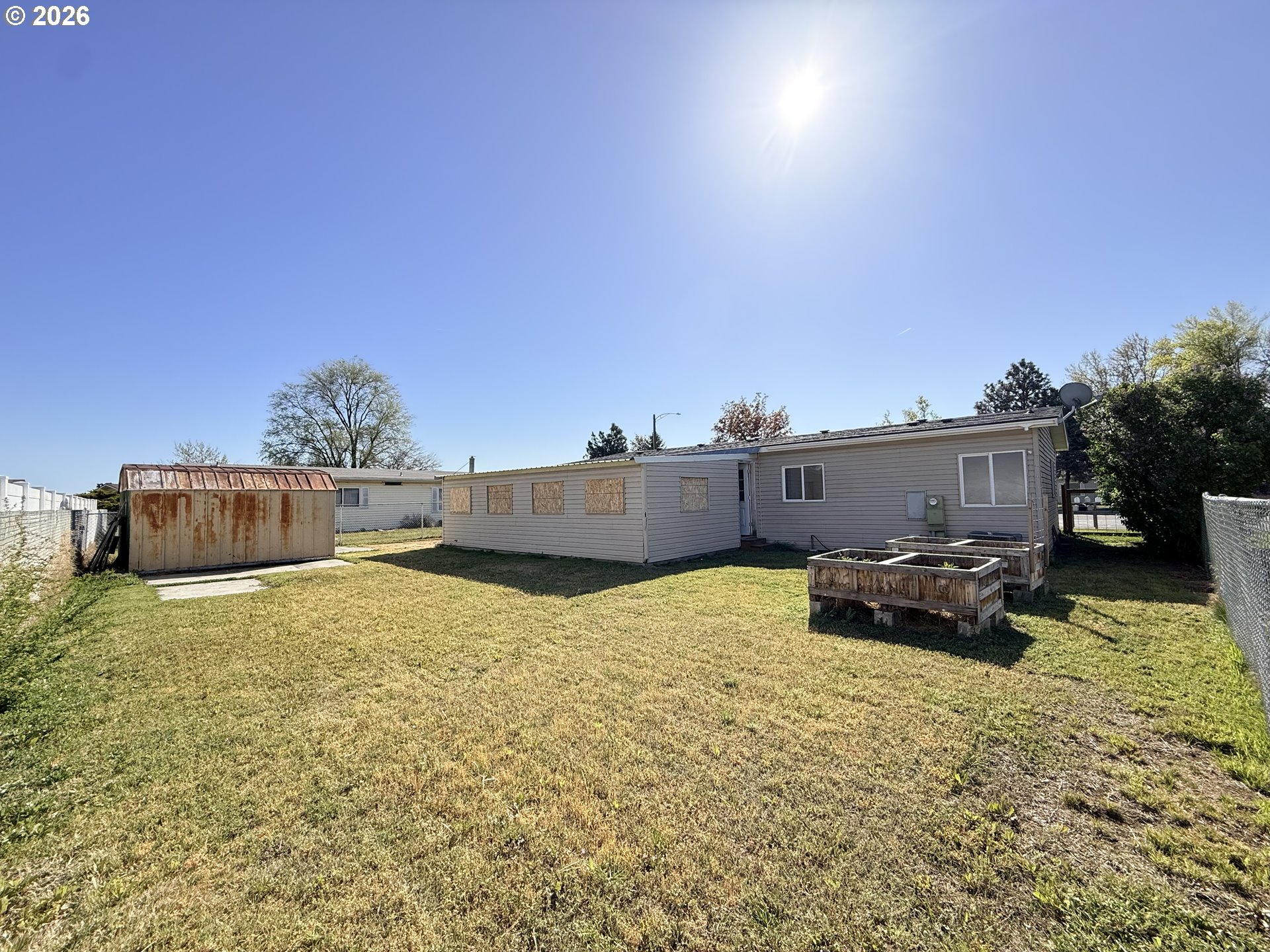 1330 West Sunland Avenue Hermiston, OR 97838 - Photo 17 of 23 a backyard of a house with table and chairs