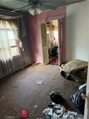 a view of livingroom with furniture and floor to ceiling window