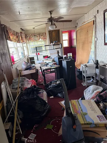 a living room with lots of furniture and a chandelier