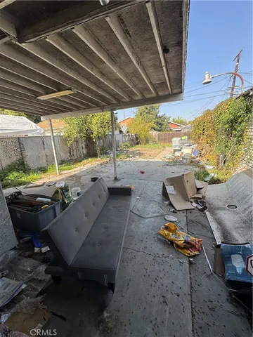 a view of a backyard with table and chairs