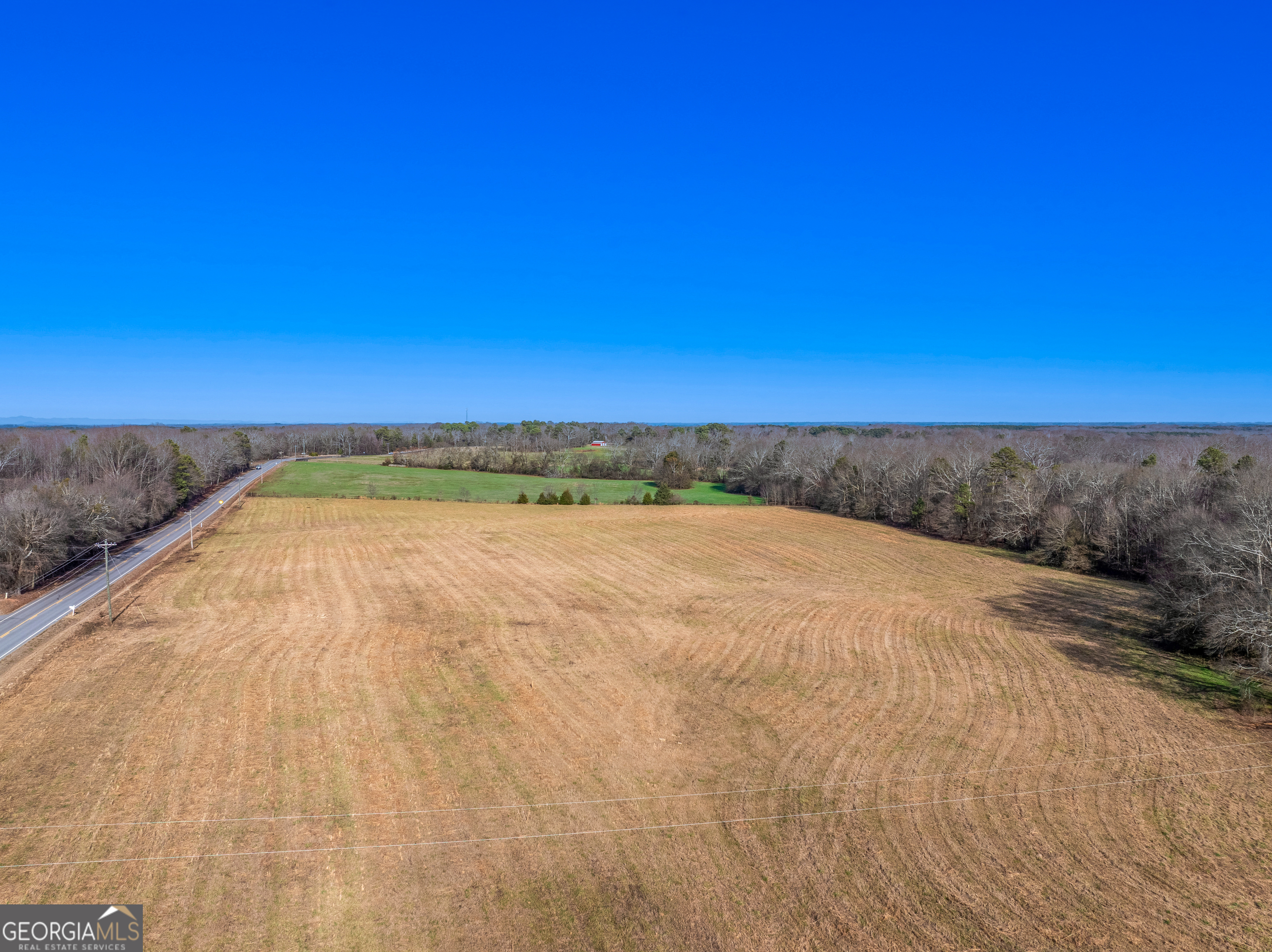 0 Reed Creek Highway Hartwell, GA 30643 - Photo 3 of 15 a view of a dry yard with wooden fence