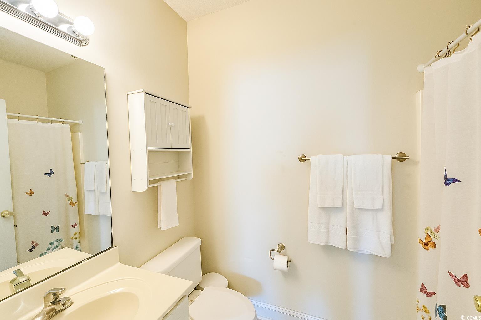 1100 Commons Boulevard, Unit 508 Myrtle Beach, SC 29572 - Photo 15 of 24 Full bath featuring a shower with curtain and vanity