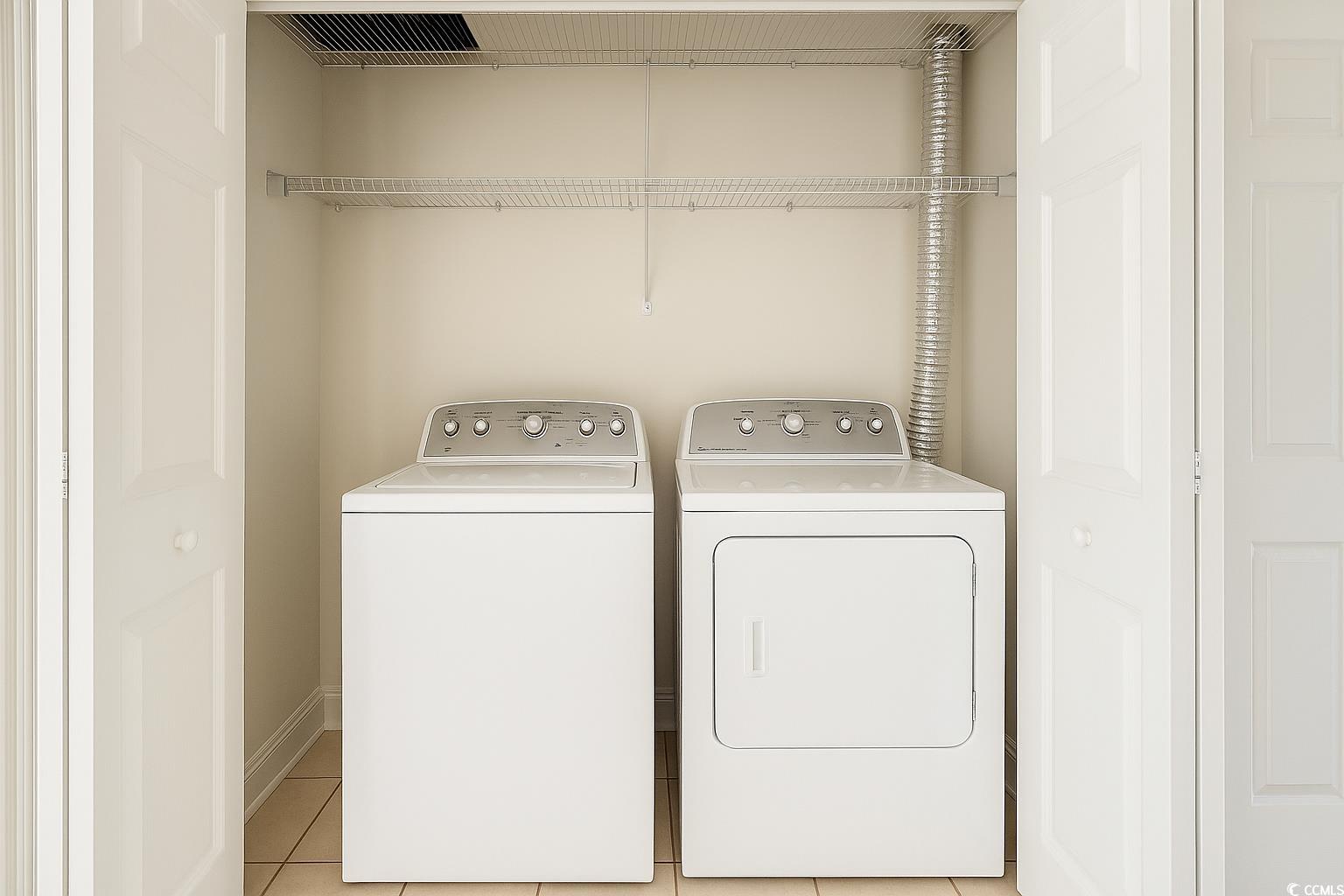 1100 Commons Boulevard, Unit 508 Myrtle Beach, SC 29572 - Photo 17 of 24 Laundry room featuring light tile patterned floors and independent washer and dryer