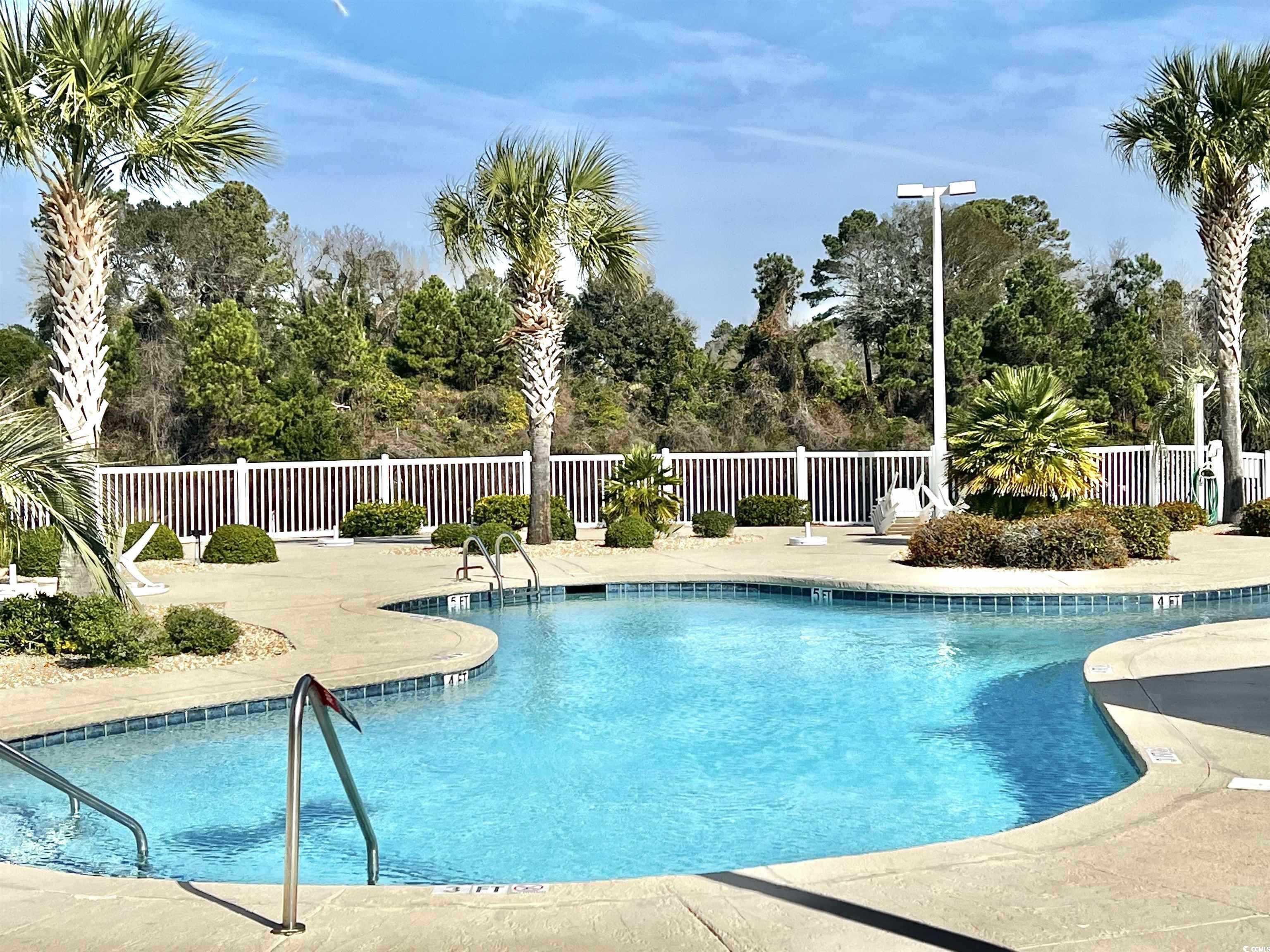 1100 Commons Boulevard, Unit 508 Myrtle Beach, SC 29572 - Photo 19 of 24 Community pool featuring a patio