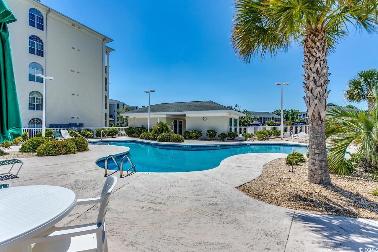 1100 Commons Boulevard, Unit 508 Myrtle Beach, SC 29572 - Photo 21 of 24 Community pool with a patio area