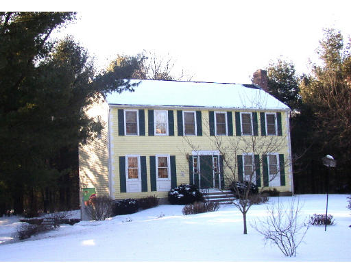 349 Hudson Road Stow, MA 01775 - Photo 1 of 10 front view of a house with a yard