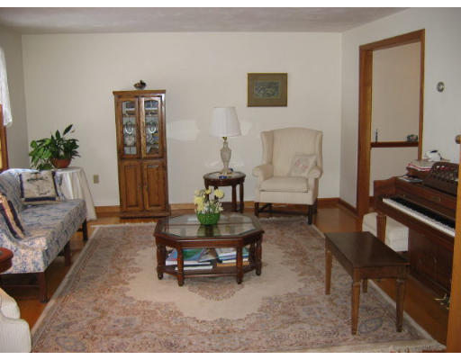 349 Hudson Road Stow, MA 01775 - Photo 2 of 10 a living room with furniture and a potted plant