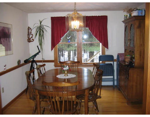 349 Hudson Road Stow, MA 01775 - Photo 3 of 10 a view of a dining room with furniture and chandelier