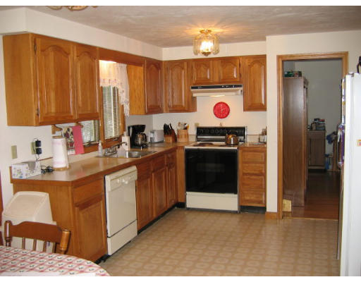 349 Hudson Road Stow, MA 01775 - Photo 4 of 10 a kitchen with stainless steel appliances granite countertop a stove a sink and a refrigerator