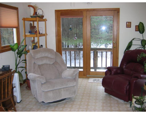 349 Hudson Road Stow, MA 01775 - Photo 5 of 10 a living room with furniture and a large window
