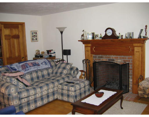 349 Hudson Road Stow, MA 01775 - Photo 6 of 10 a living room with furniture and a fireplace