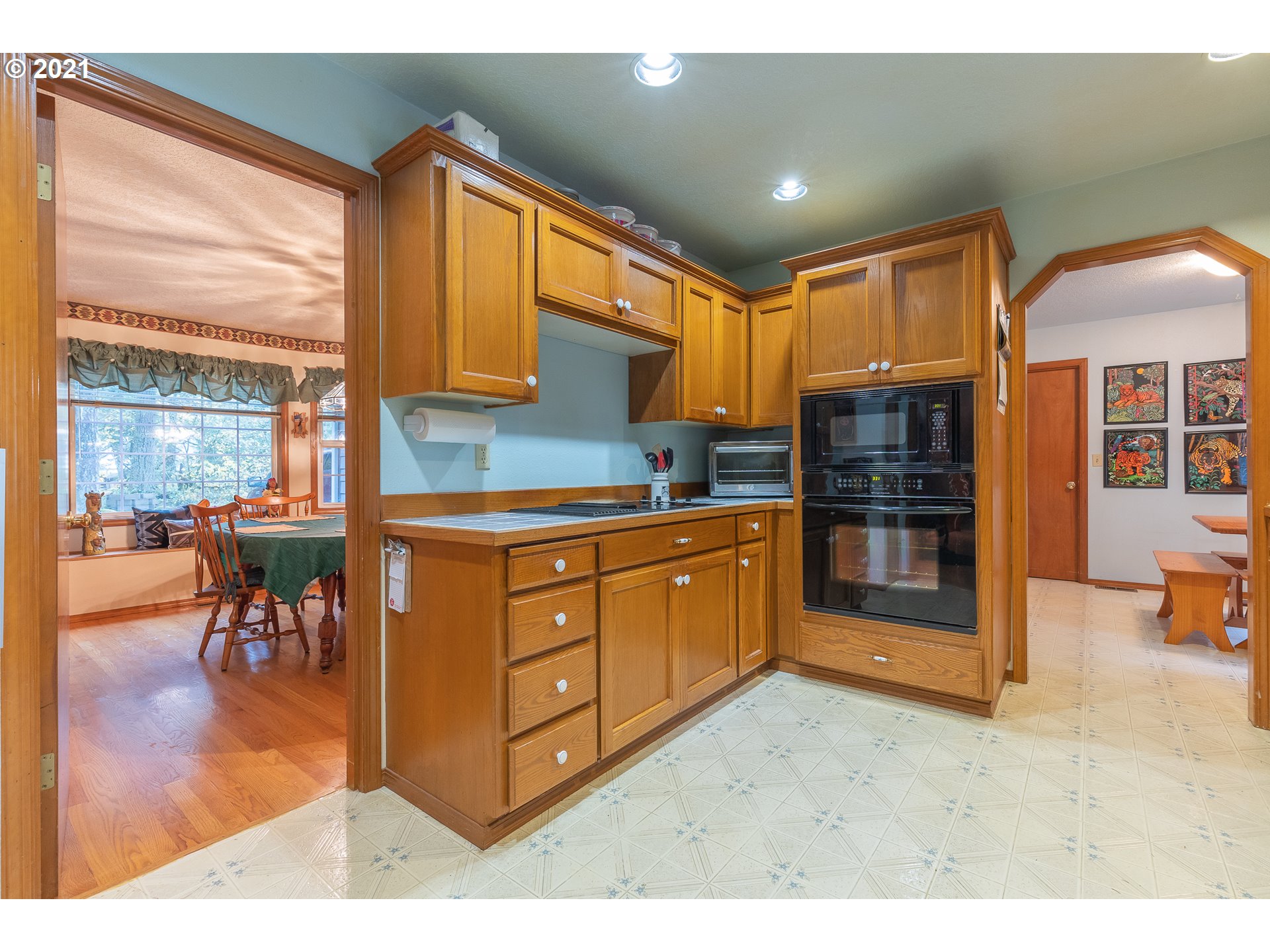 69280 East Barlow Trail Road Rhododendron, OR 97049 - Photo 14 of 25 a kitchen with stainless steel appliances kitchen island granite countertop a refrigerator and cabinets