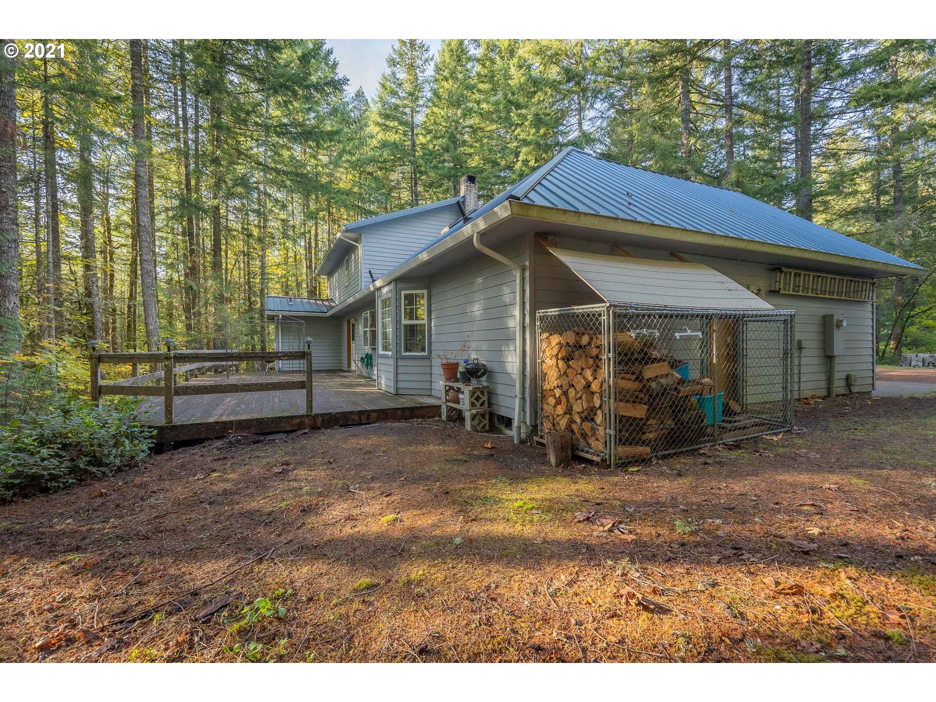69280 East Barlow Trail Road Rhododendron, OR 97049 - Photo 3 of 25 a view of a house with a patio