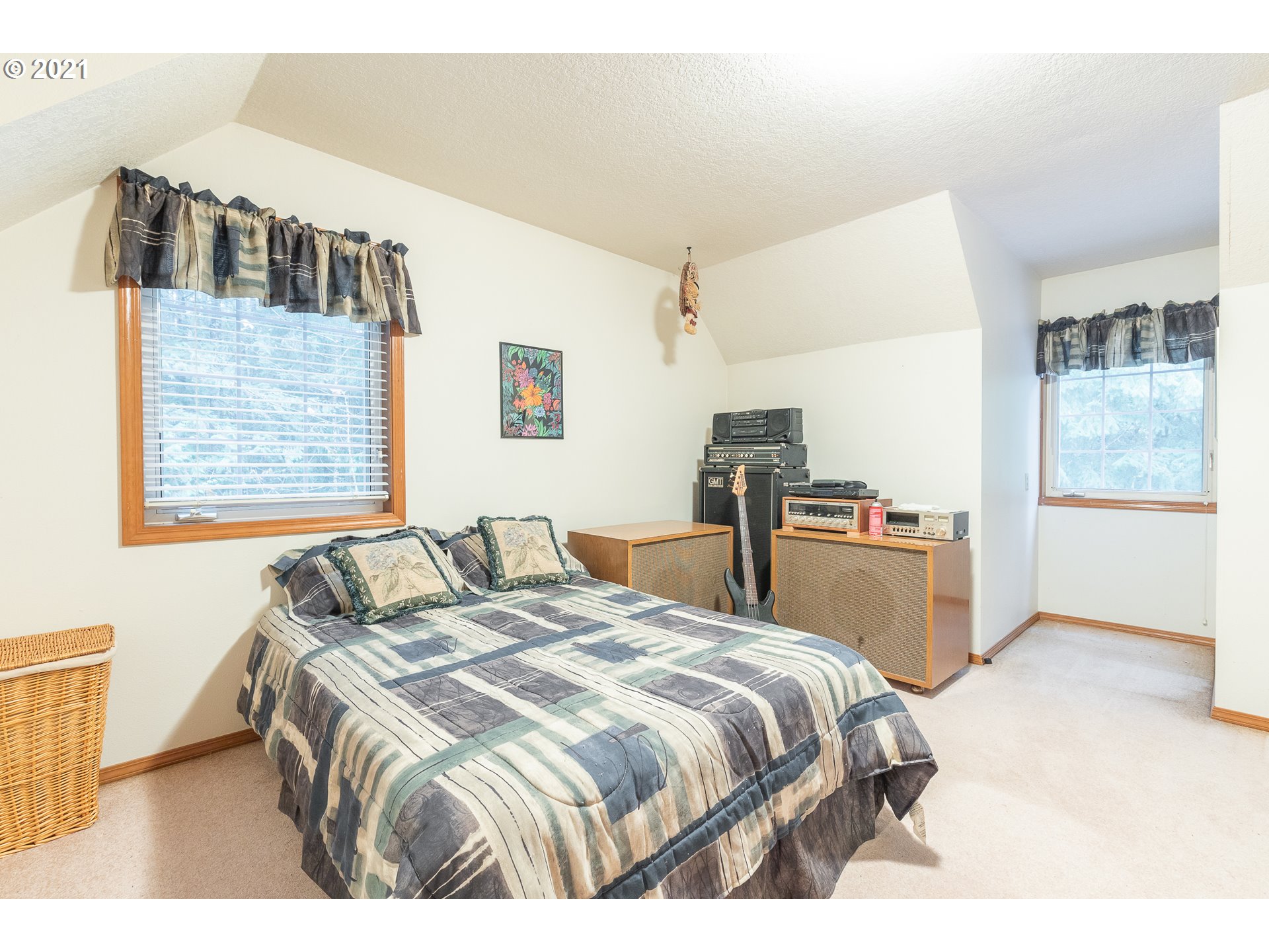 69280 East Barlow Trail Road Rhododendron, OR 97049 - Photo 22 of 25 a bedroom with a bed and a cabinets