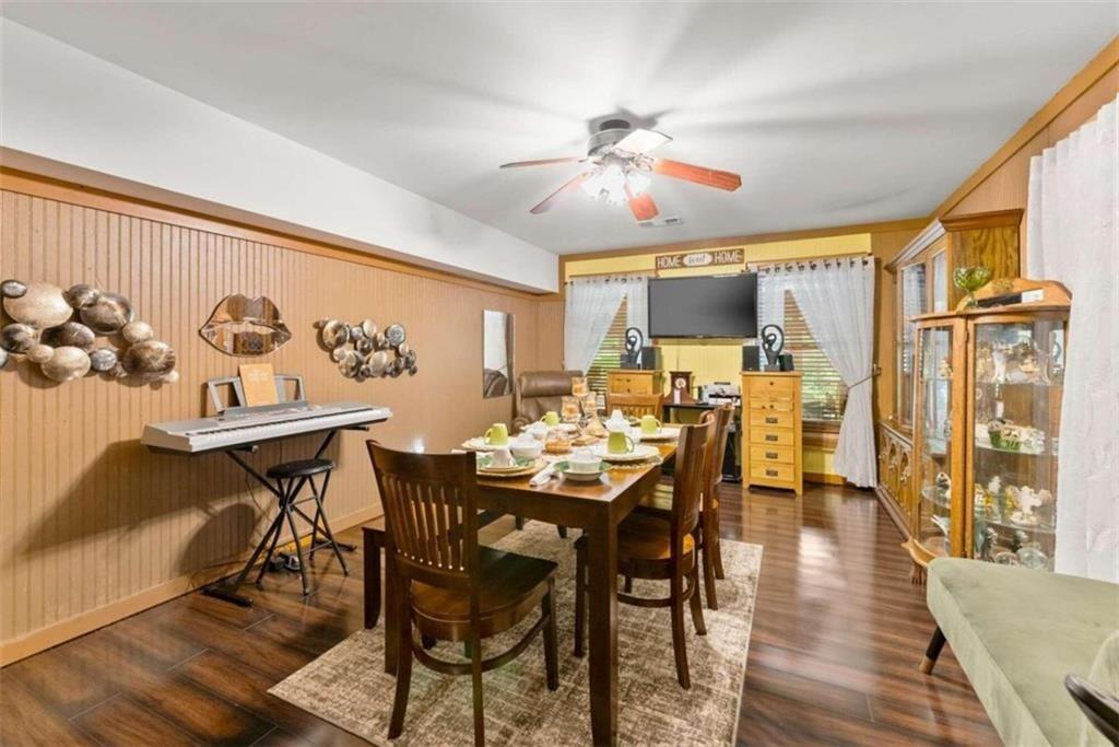 459 Gold Ridge Road Dahlonega, GA 30533 - Photo 18 of 47 a view of a dining room with furniture and wooden floor