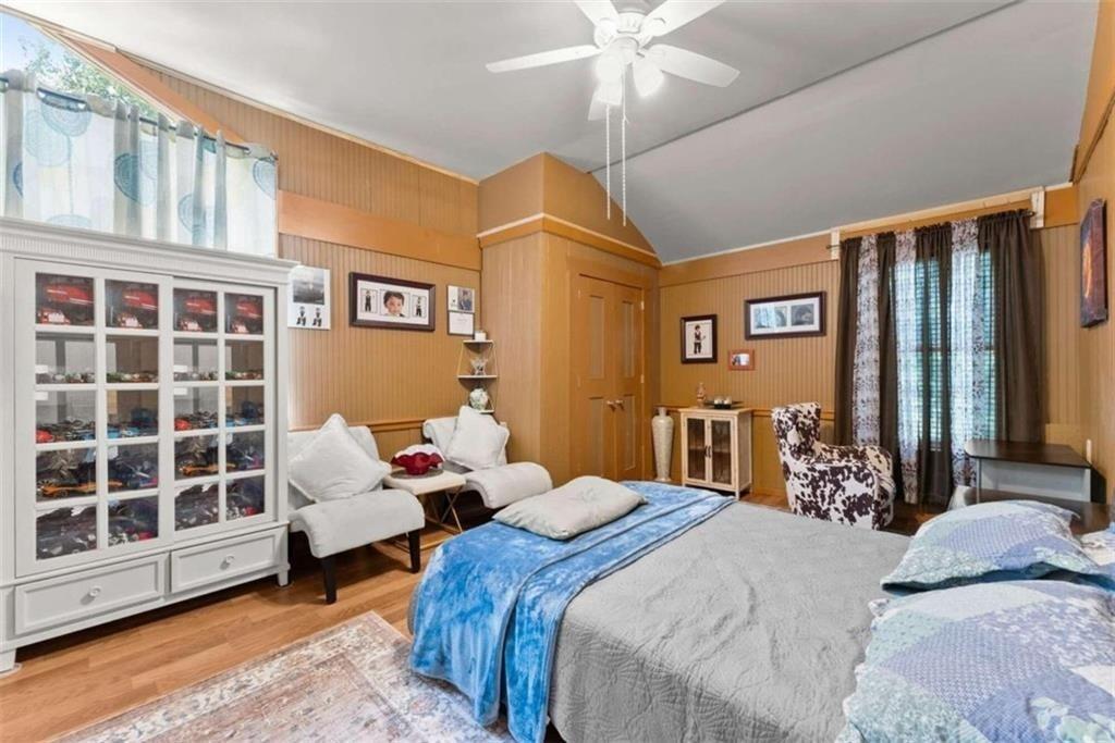 459 Gold Ridge Road Dahlonega, GA 30533 - Photo 22 of 47 a bedroom with bed and wooden floor