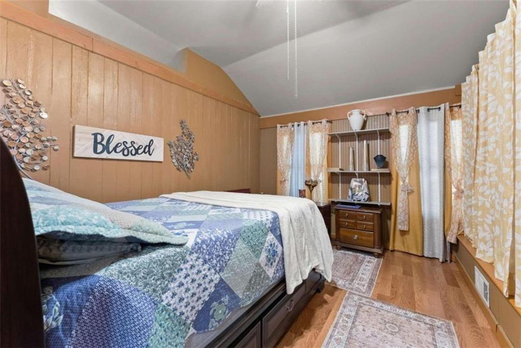 459 Gold Ridge Road Dahlonega, GA 30533 - Photo 27 of 47 a bedroom with a bed and a book shelf