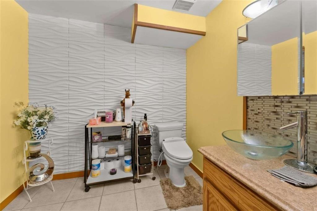 459 Gold Ridge Road Dahlonega, GA 30533 - Photo 30 of 47 a bathroom with a toilet sink and mirror