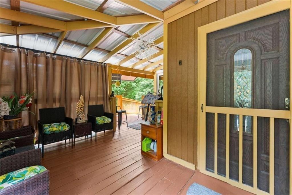 459 Gold Ridge Road Dahlonega, GA 30533 - Photo 7 of 47 a view of a chairs and table in a patio