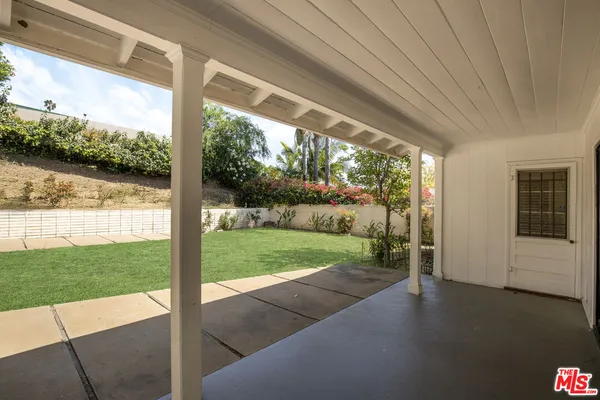 a view of a porch and garden