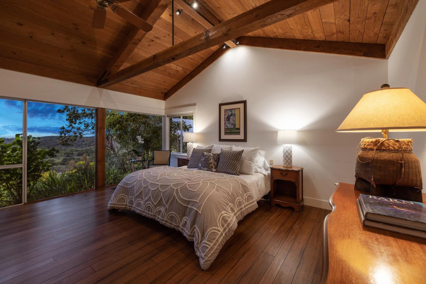 22 Preston Road Woodside, CA 94062 - Photo 49 of 60 a spacious bedroom with a bed and wooden floor