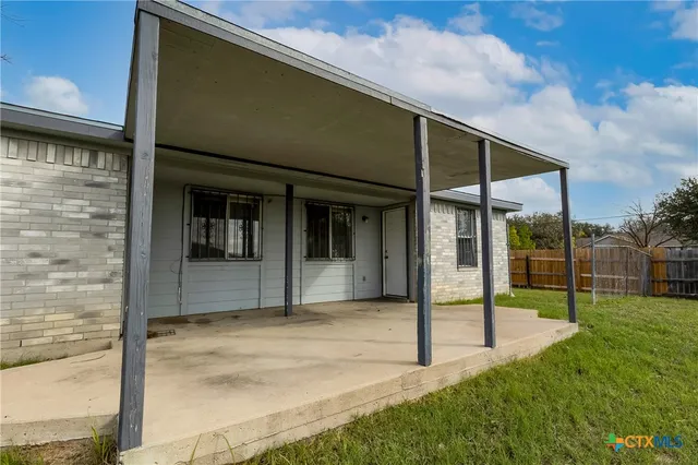 a house view with a backyard space