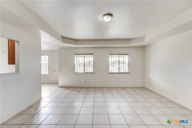 a view of an empty room and window