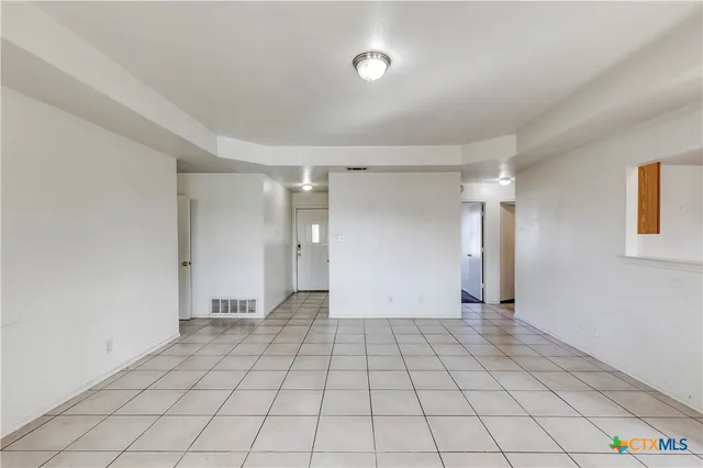 a view of an empty room and window