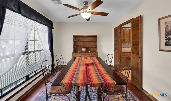 a view of a hall with furniture