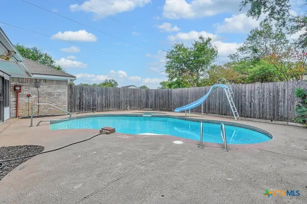 a view of a backyard with a slide