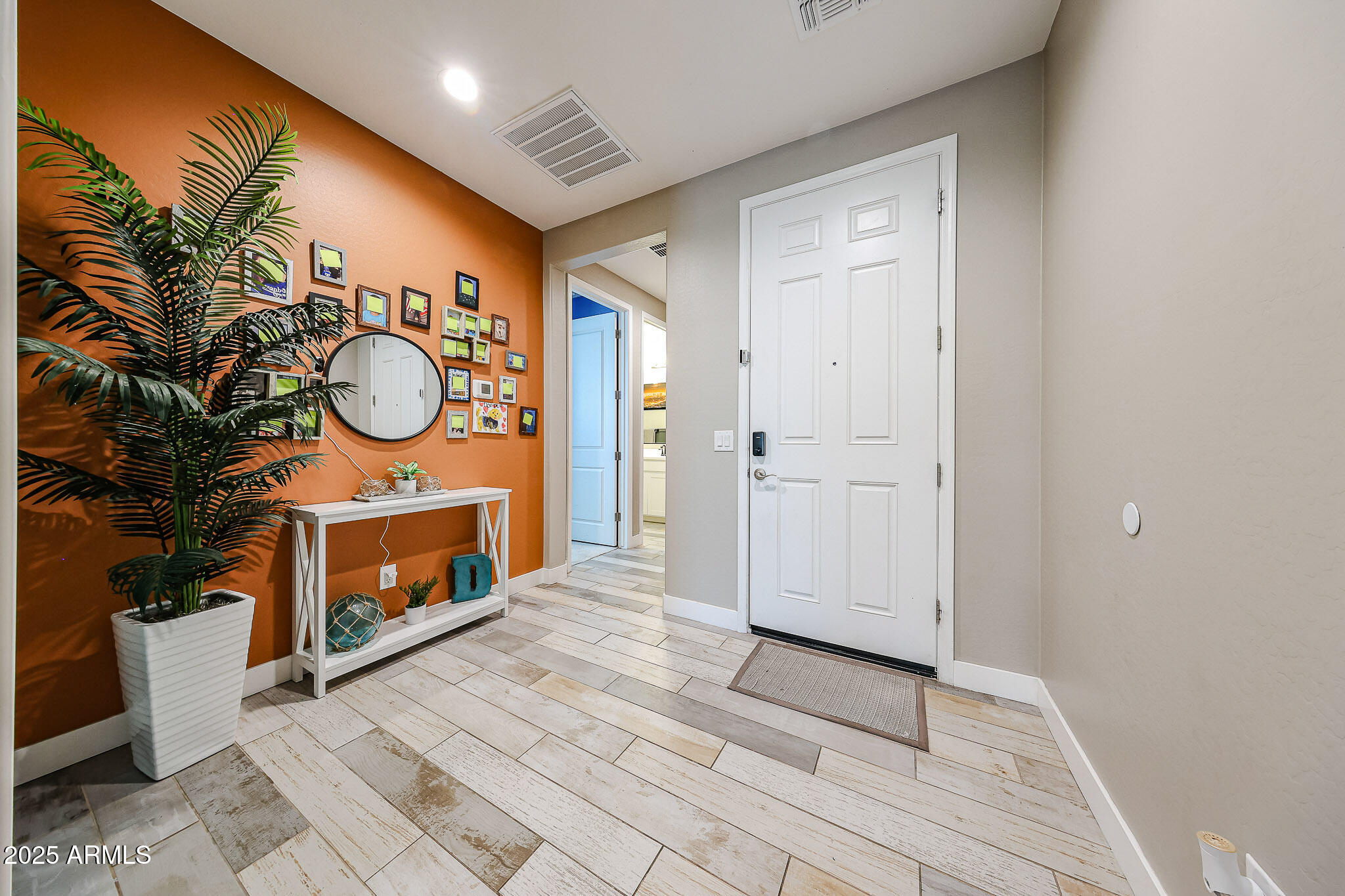 3907 South 75th Drive Phoenix, AZ 85043 - Photo 11 of 49 a view of an entryway with wooden floor